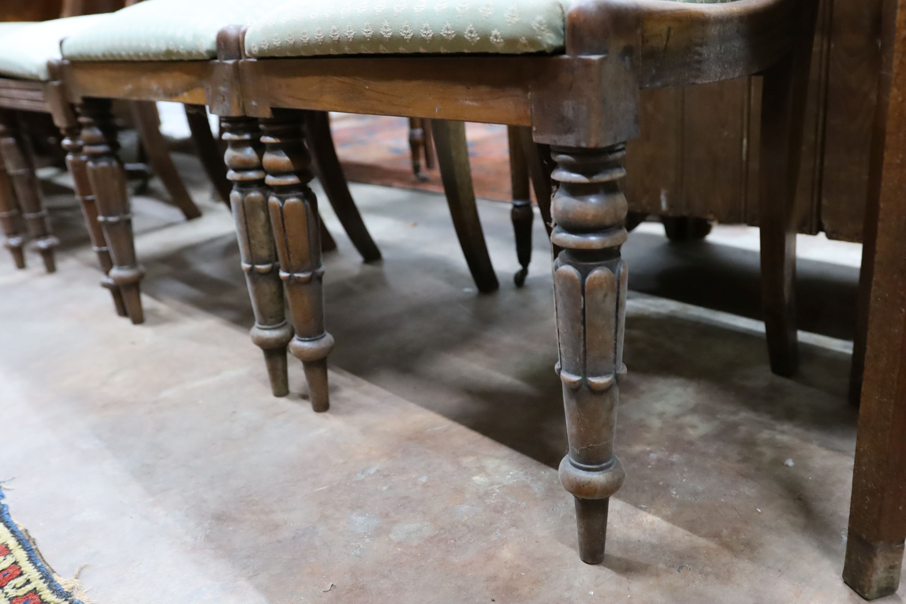 Two pairs of William IV mahogany and simulated rosewood dining chairs